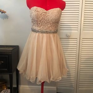 Tan/gold strapless mini party dress with beautiful detailing.